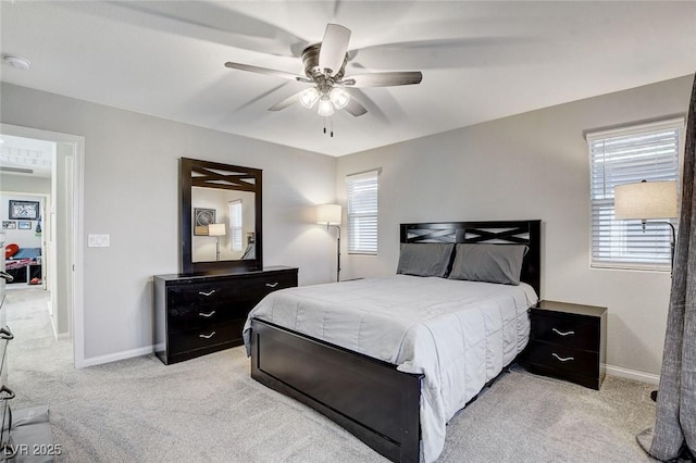 bedroom featuring ceiling fan and light colored carpet