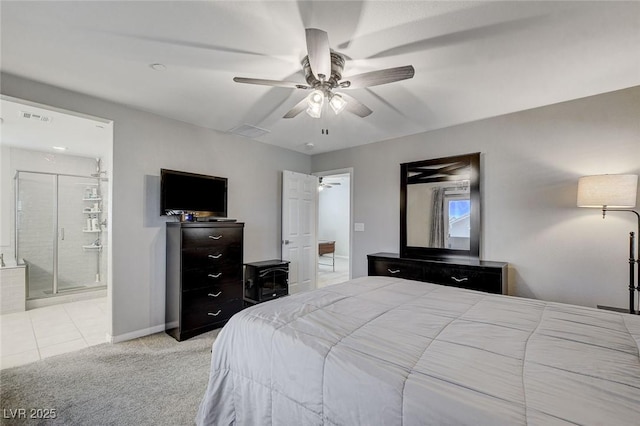 bedroom with ceiling fan, light carpet, and ensuite bath