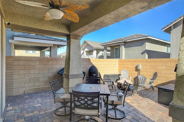 view of patio featuring ceiling fan