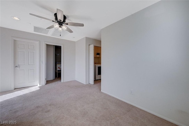 unfurnished bedroom with ceiling fan and light carpet