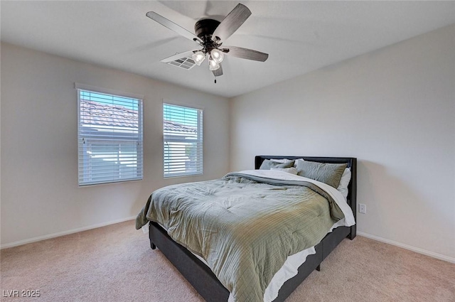 bedroom featuring ceiling fan and light carpet