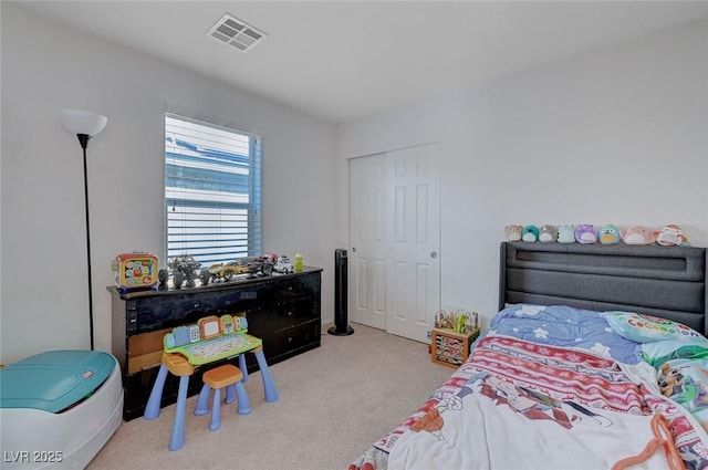 carpeted bedroom with a closet