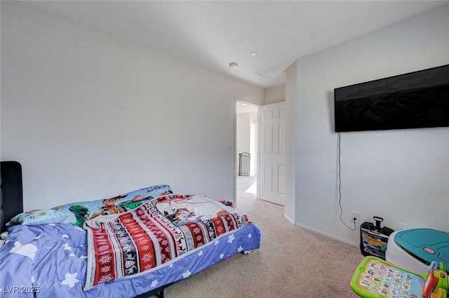 bedroom with light carpet