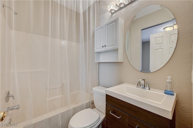 full bathroom featuring shower / tub combination, vanity, and toilet