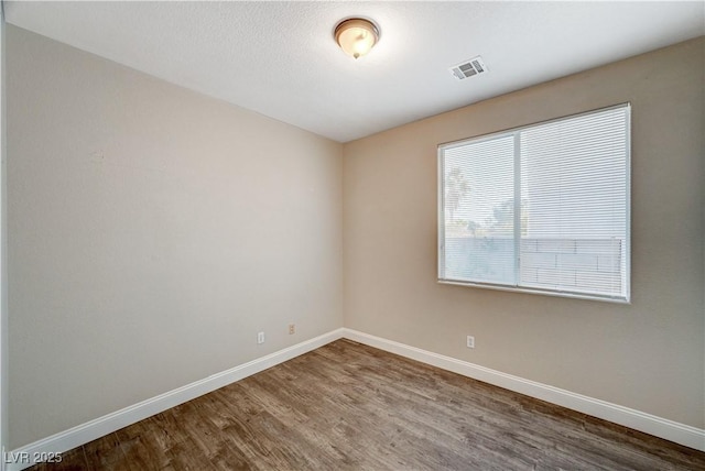 empty room featuring hardwood / wood-style floors