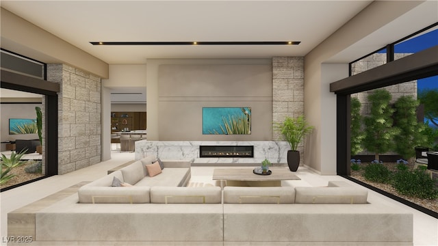 living room with a high end fireplace