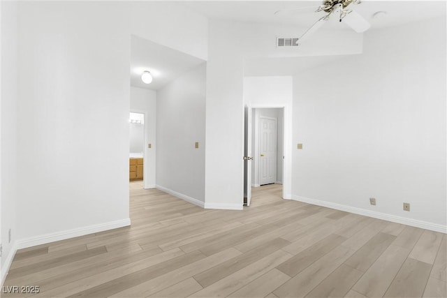 unfurnished room with ceiling fan and light wood-type flooring