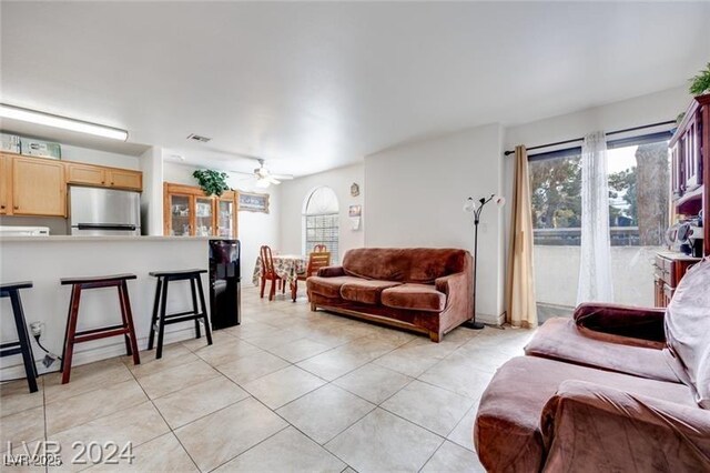 2983 Juniper Hills Blvd Unit 102, Las Vegas, NV 89142 - living room with light tile patterned flooring and a ceiling fan