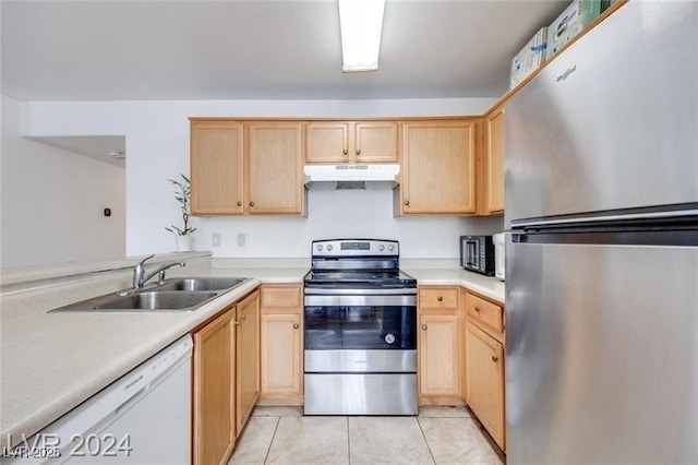 kitchen featuring sink, light tile patterned floors, light brown cabinets, and appliances with stainless steel finishes