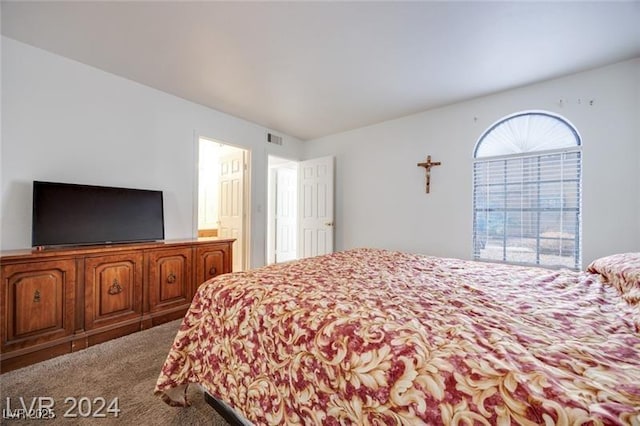 carpeted bedroom featuring multiple windows