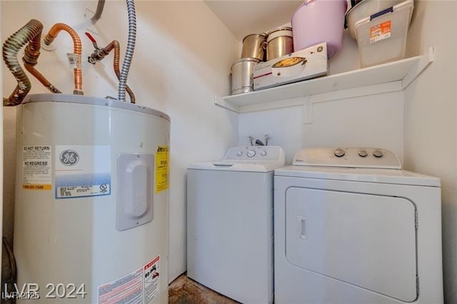 washroom featuring washing machine and dryer and water heater