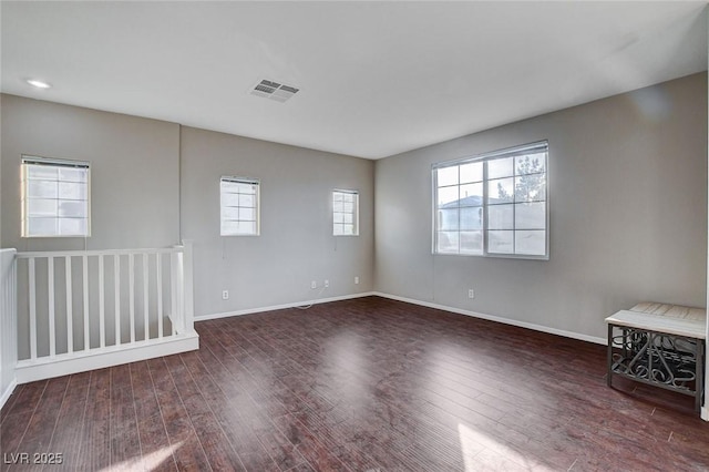 empty room with dark hardwood / wood-style floors