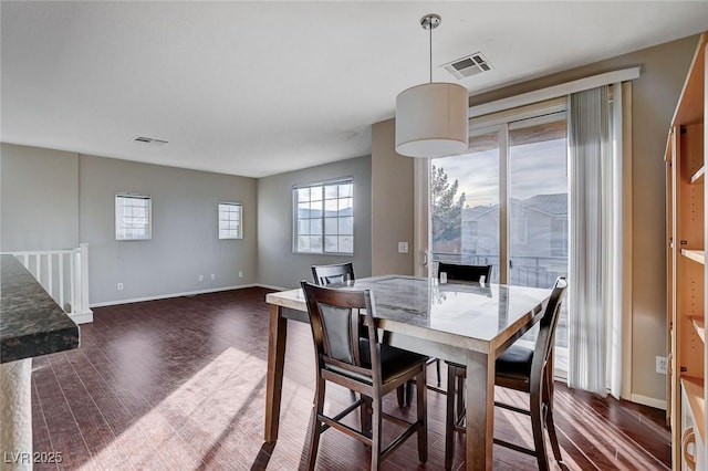 dining room with dark hardwood / wood-style floors