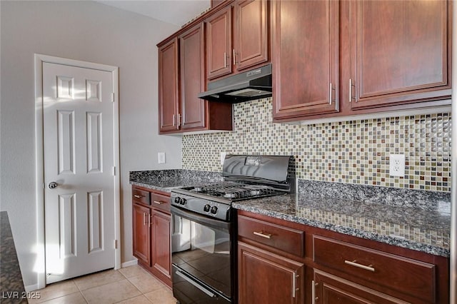 kitchen featuring gas stove, dark stone countertops, backsplash, and light tile patterned floors