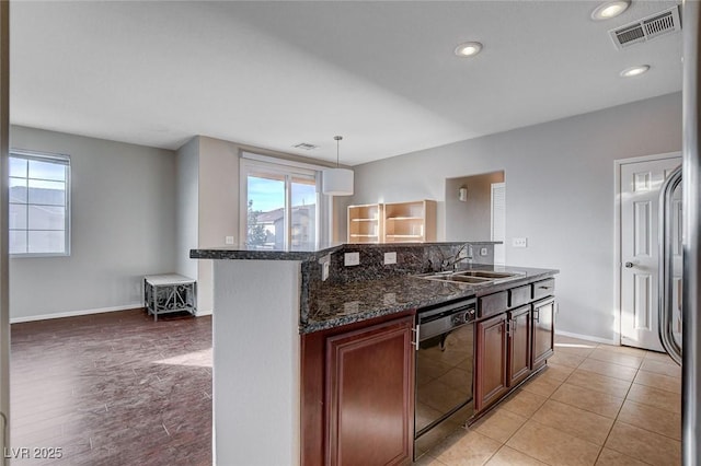 kitchen featuring pendant lighting, sink, dark stone countertops, backsplash, and black dishwasher