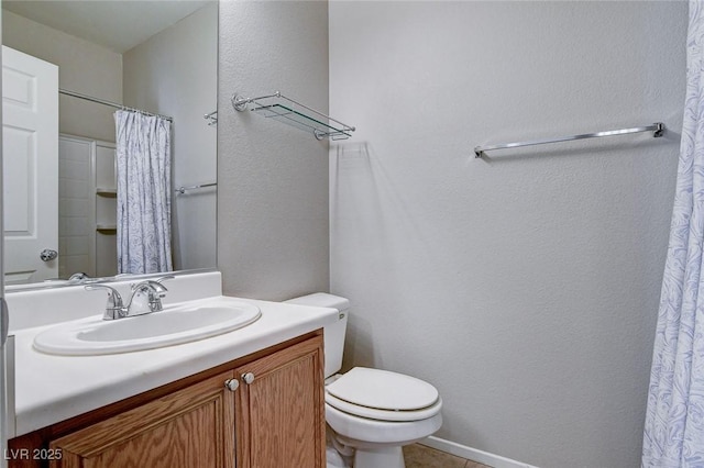 bathroom featuring tile patterned flooring, vanity, curtained shower, and toilet