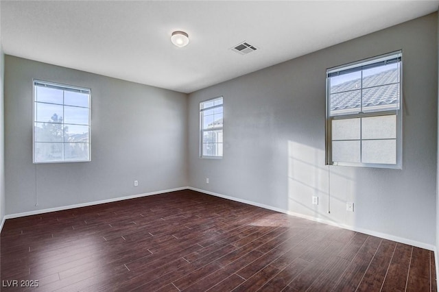 unfurnished room featuring dark hardwood / wood-style flooring