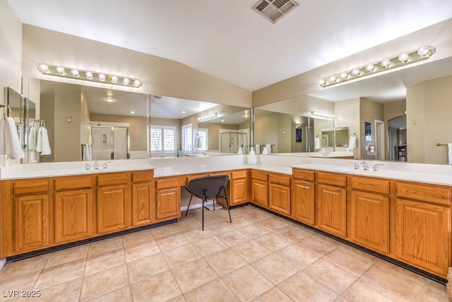 bathroom with lofted ceiling, an enclosed shower, tile patterned flooring, and vanity