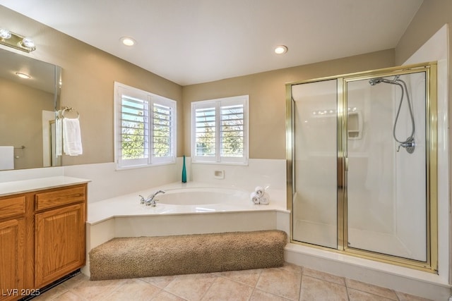 bathroom featuring tile patterned floors, vanity, and separate shower and tub