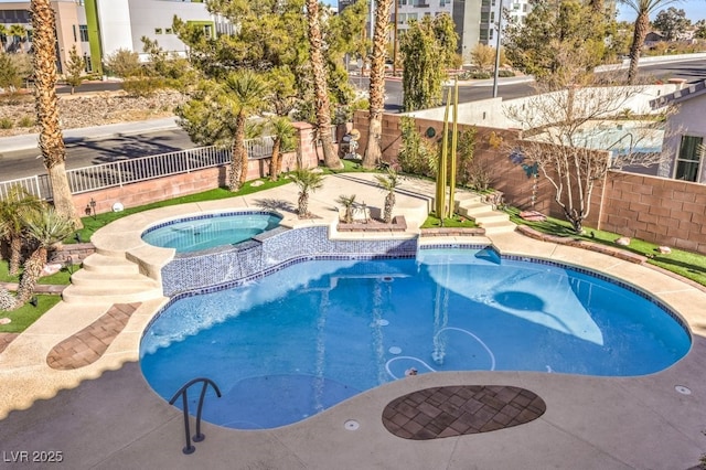 view of swimming pool featuring an in ground hot tub and a patio area