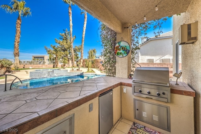 view of patio / terrace featuring a grill, a wall mounted air conditioner, a fenced in pool, and an outdoor kitchen