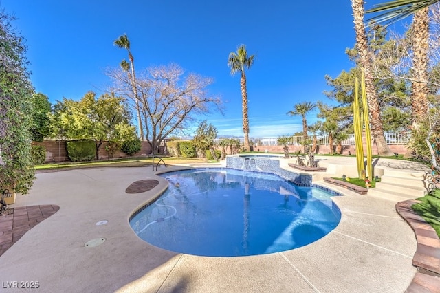 view of swimming pool with a patio and an in ground hot tub