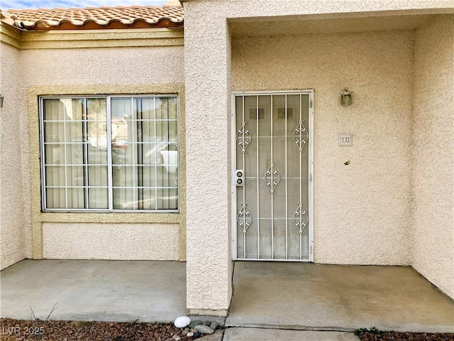 doorway to property with a patio area