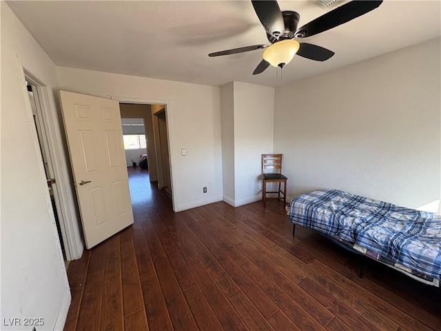 bedroom with visible vents, baseboards, a ceiling fan, and hardwood / wood-style flooring