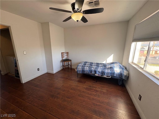 unfurnished bedroom featuring visible vents, baseboards, and wood-type flooring