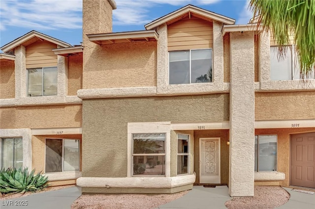 3891 Terrazzo Ave, Las Vegas, NV 89115 - townhome / multi-family property with a chimney and stucco siding