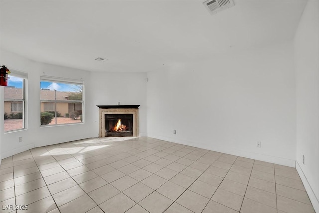 3891 Terrazzo Ave, Las Vegas, NV 89115 - unfurnished living room featuring a high end fireplace, light tile patterned flooring, and visible vents