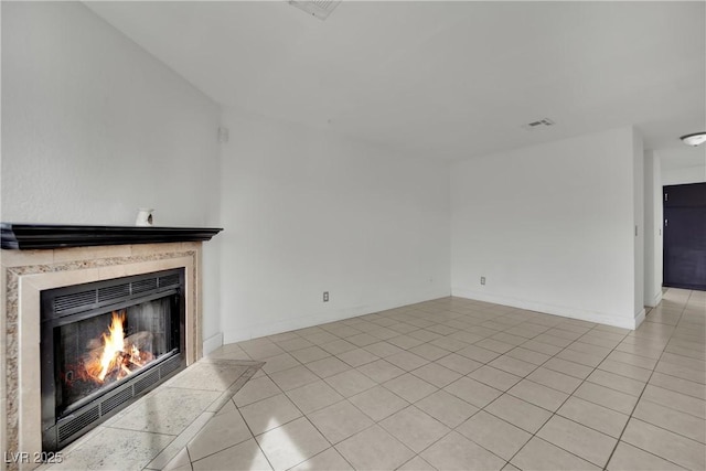 3891 Terrazzo Ave, Las Vegas, NV 89115 - unfurnished living room with baseboards, a fireplace, and light tile patterned floors