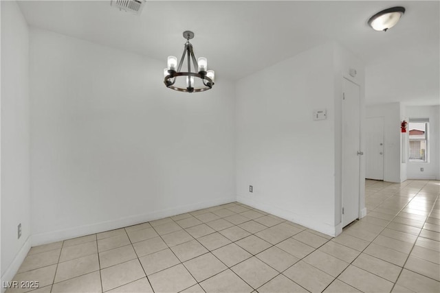 3891 Terrazzo Ave, Las Vegas, NV 89115 - empty room with light tile patterned floors, a notable chandelier, baseboards, and visible vents