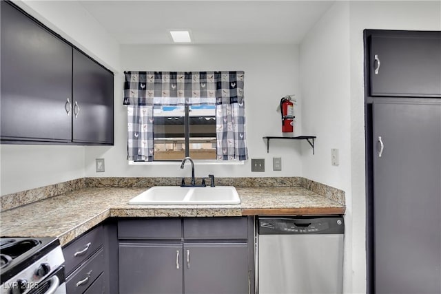 3891 Terrazzo Ave, Las Vegas, NV 89115 - kitchen with tile counters, a sink, gray cabinetry, and appliances with stainless steel finishes
