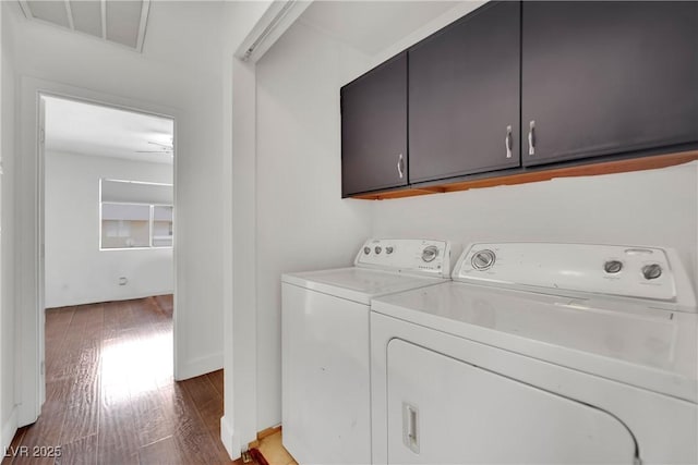 3891 Terrazzo Ave, Las Vegas, NV 89115 - laundry area with washing machine and clothes dryer, visible vents, cabinet space, and light wood-type flooring