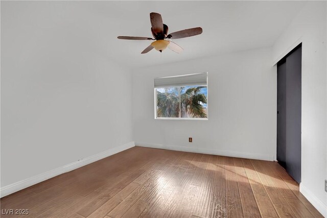 3891 Terrazzo Ave, Las Vegas, NV 89115 - unfurnished room with hardwood / wood-style floors, baseboards, and ceiling fan