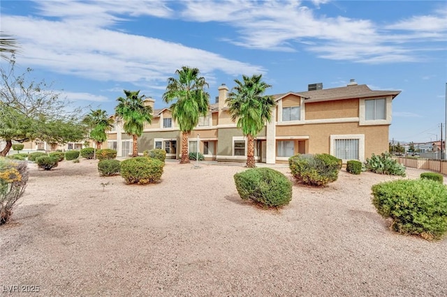 3891 Terrazzo Ave, Las Vegas, NV 89115 - back of property with stucco siding and a chimney