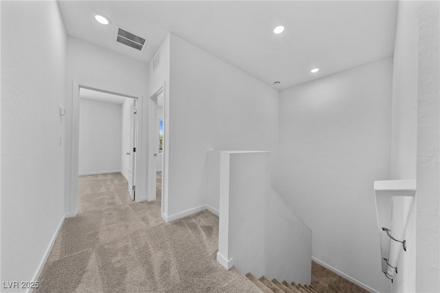 hallway with light carpet