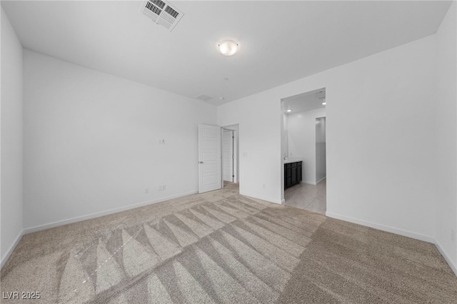 empty room featuring light colored carpet