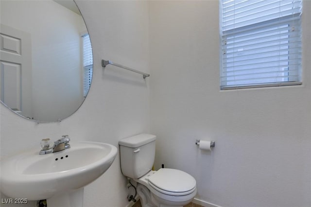 bathroom with toilet and sink