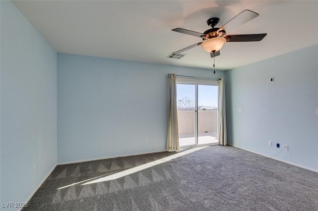 spare room featuring ceiling fan and carpet