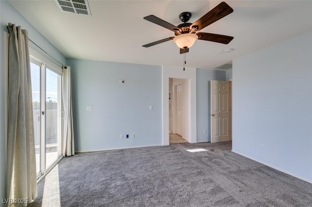 carpeted empty room featuring ceiling fan