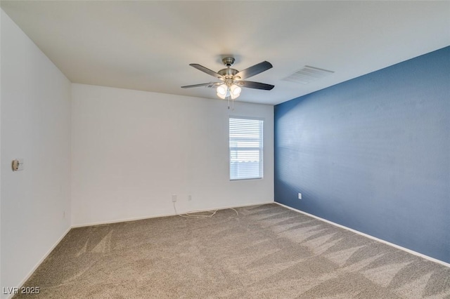 unfurnished room with carpet flooring and ceiling fan