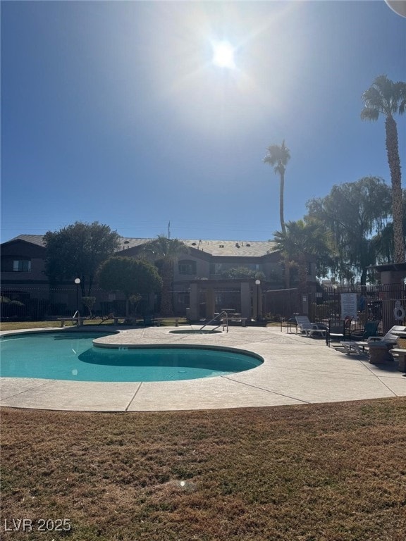 view of swimming pool featuring a patio area