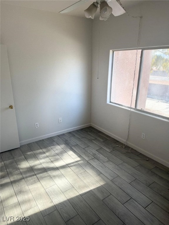 spare room featuring ceiling fan and light hardwood / wood-style flooring