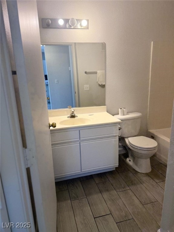 full bathroom with vanity,  shower combination, and toilet