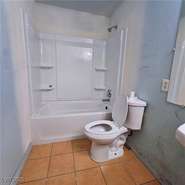 bathroom featuring shower / tub combination, toilet, and tile patterned flooring