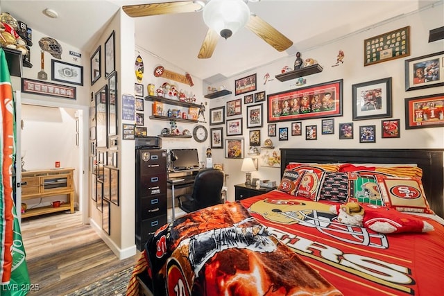 bedroom featuring hardwood / wood-style flooring and ceiling fan