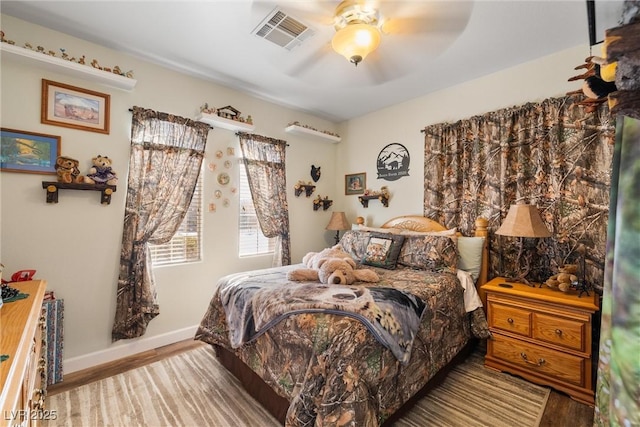 bedroom featuring ceiling fan and light hardwood / wood-style flooring