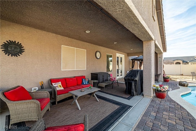 view of patio with french doors, grilling area, an outdoor living space, and a fenced in pool